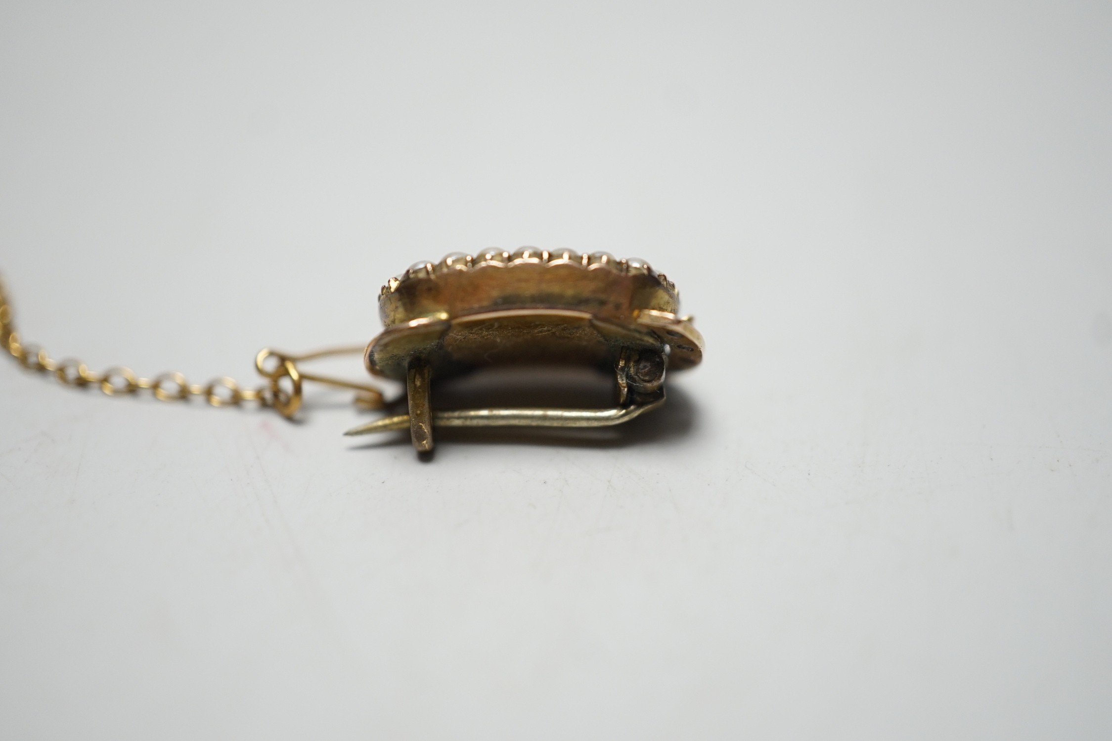 A George III yellow metal and plated hair mourning brooch, engraved 'BH, July 11th, 1815', 16mm, (ex clasp, now mounted as a brooch).